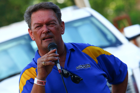 Series Director Sam Driggers addresses a driver's meeting. 